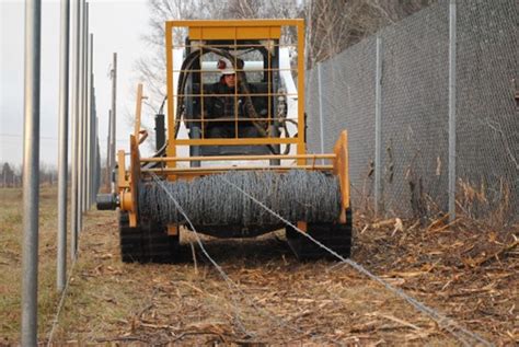 fence roller for skid steer|wire winder for fence.